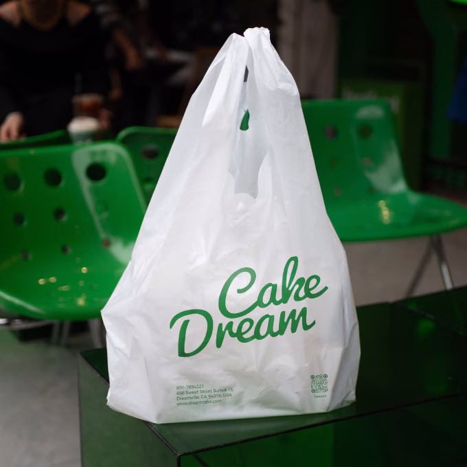 Custom White Plastic T-Shirt Bag With Sturdy Handles